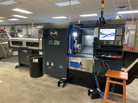 CNC LATHES THAT LOWER THE BARRIERS TO BUY, .
